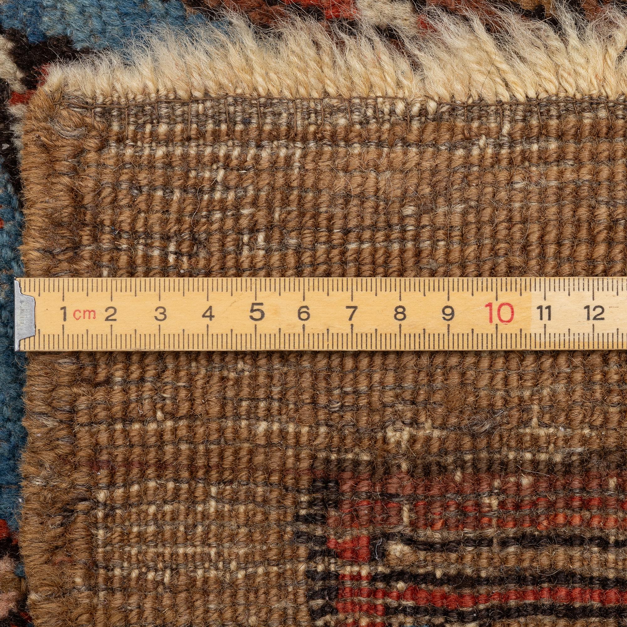 An antique Sarab rug, northwestern Iran, c. 213 x 107 cm.