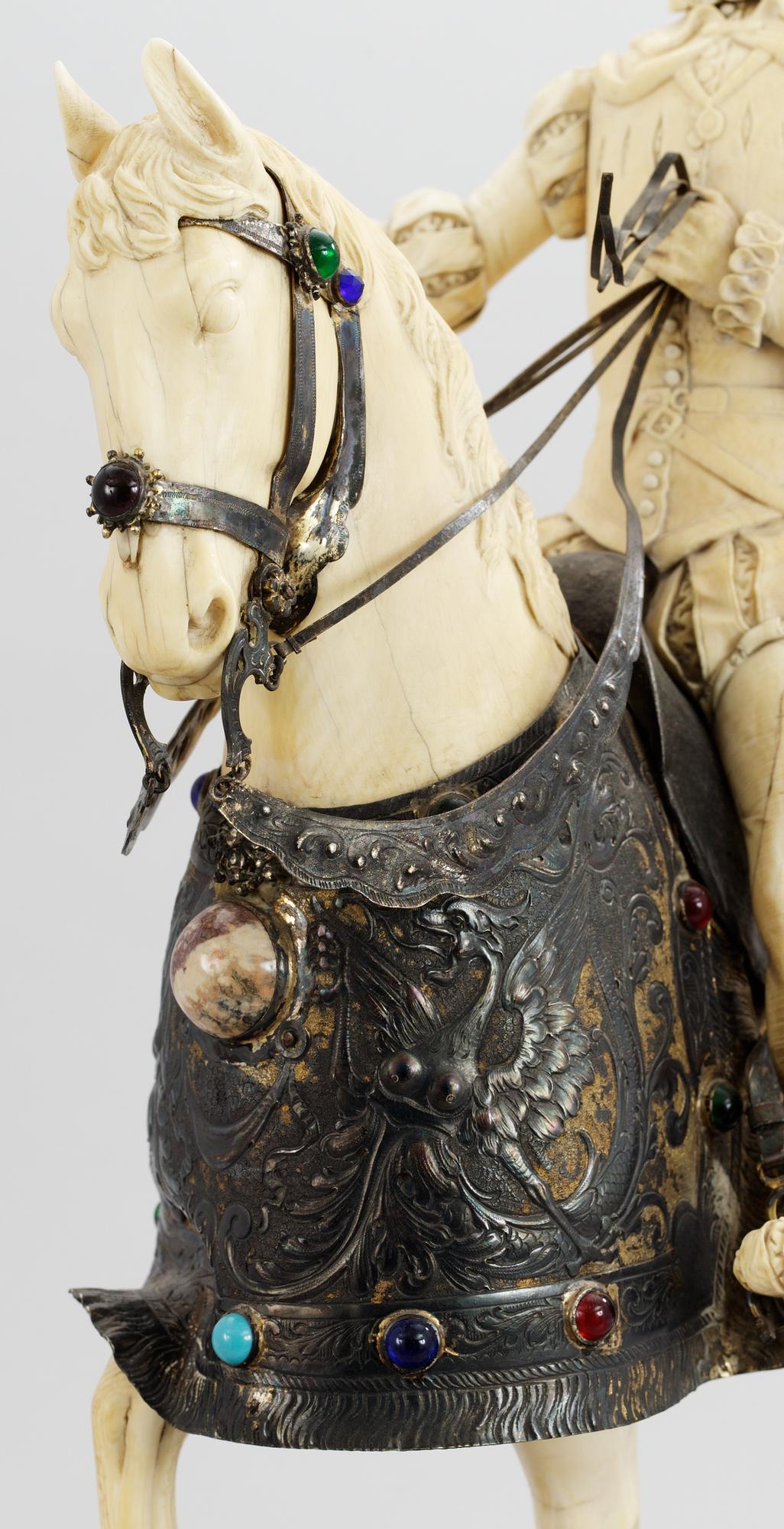 A late 19th century equestrian ivory, wood and metal statue.