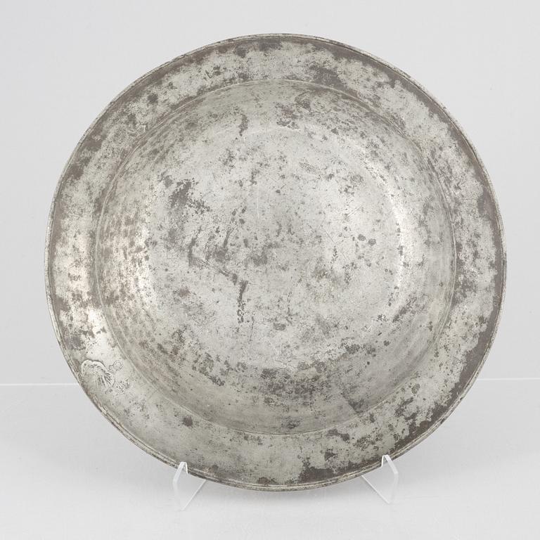 A large pewter charger, Sweden, dated 1701.