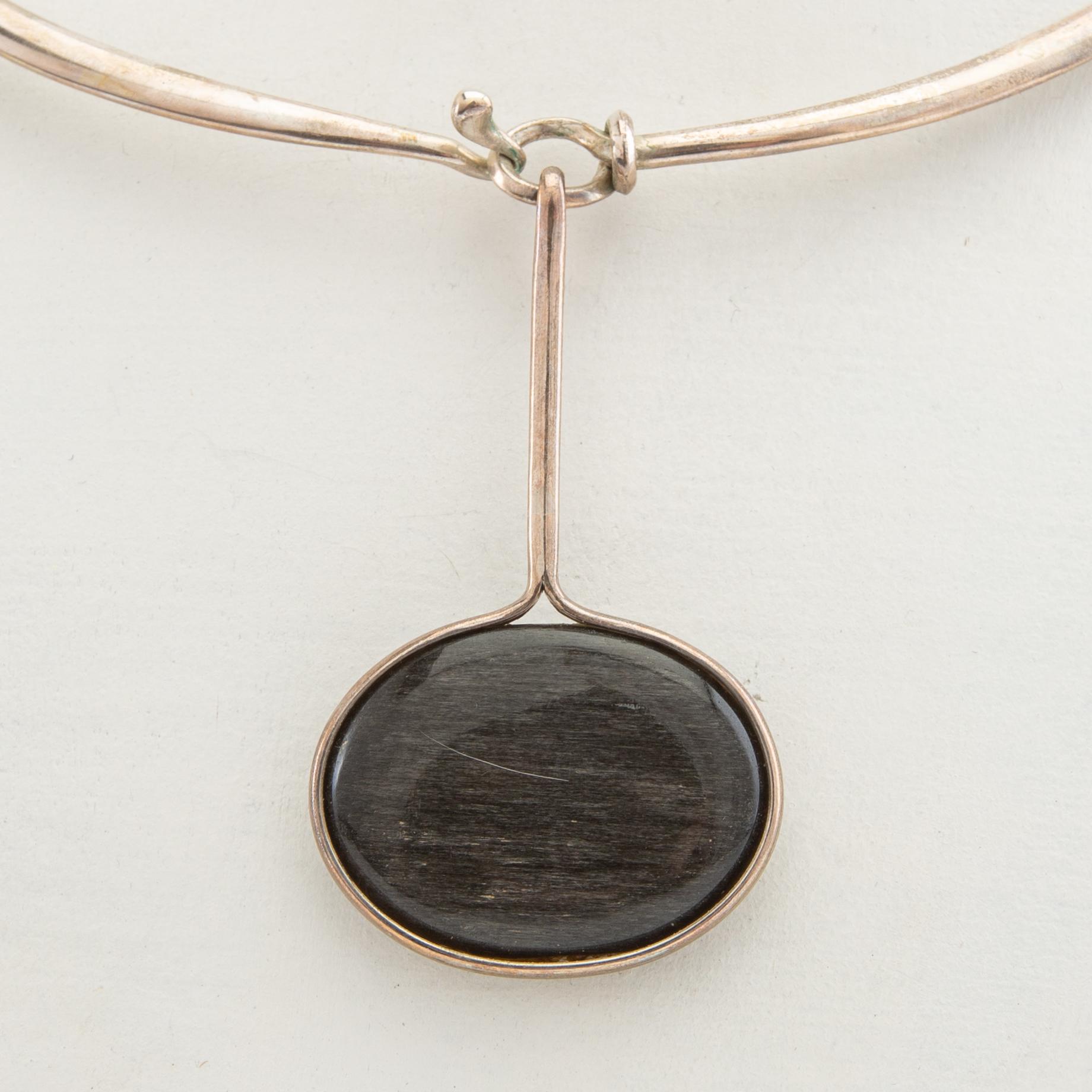 Vivianna Torun Bülow-Hübe, Necklace with pendant and a pair of earrings by Georg Jensen, Denmark, sterling silver and stone.