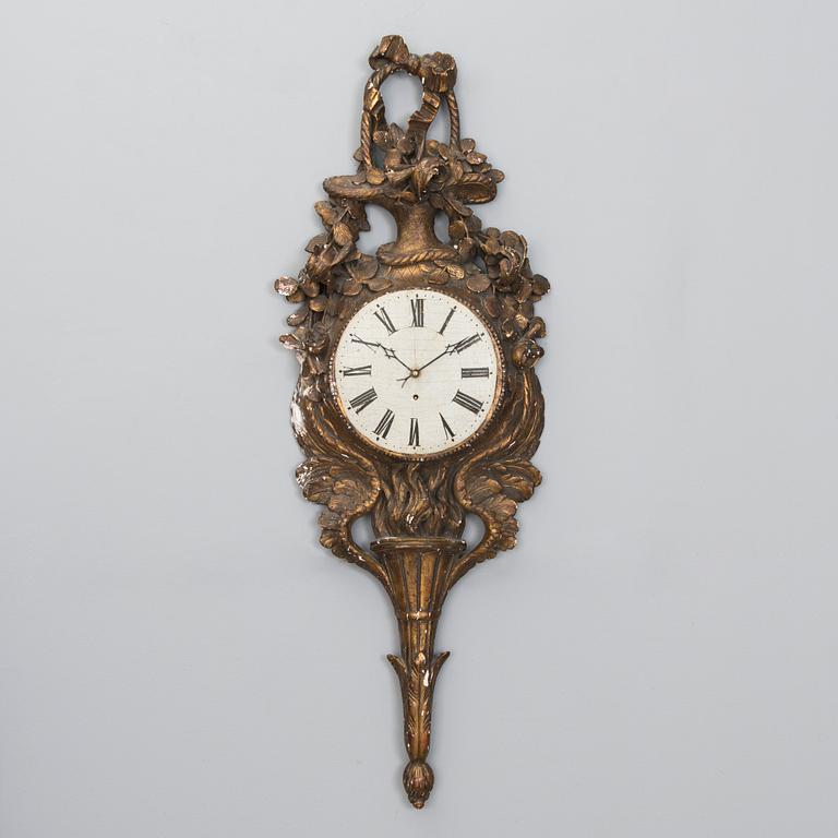 A 18th century wall clock.