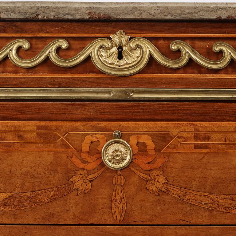 A Gustavian marquetry, ormolu-mounted and limestone-top commode by Georg Haupt (master in Stockholm 1770-84).