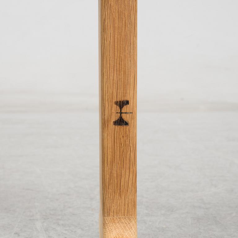 A model JH 575 coffee table by Hans J Wegner for Johannes Hansen.