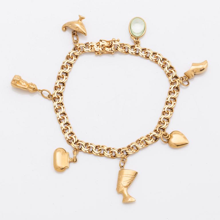 T AHLBERG & CO armband med berlocker 18K guld Stockhlom 1973, total vikt 16 gram.
