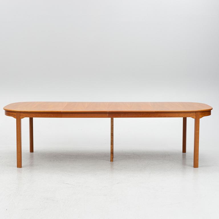 Carl Malmsten, a model "Ambassadör" dining table with ten chairs, Sweden, second half of the 20th century.