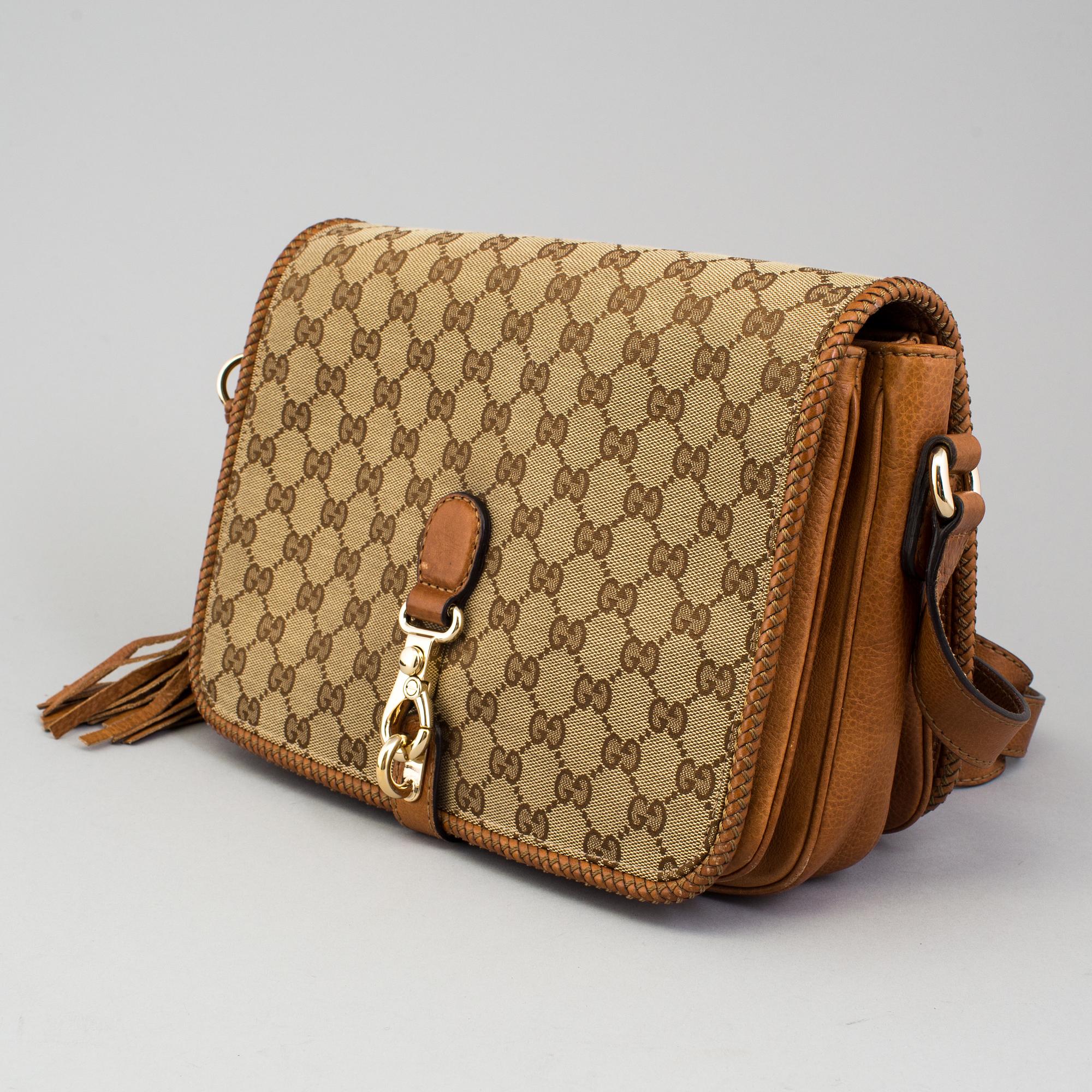 A 'Marrakech Medium Messenger Bag' by Gucci.