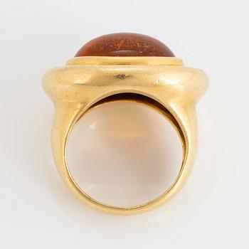 A Paloma Picasso Tiffany ring in 18K gold set with a cabochon-cut citrine.