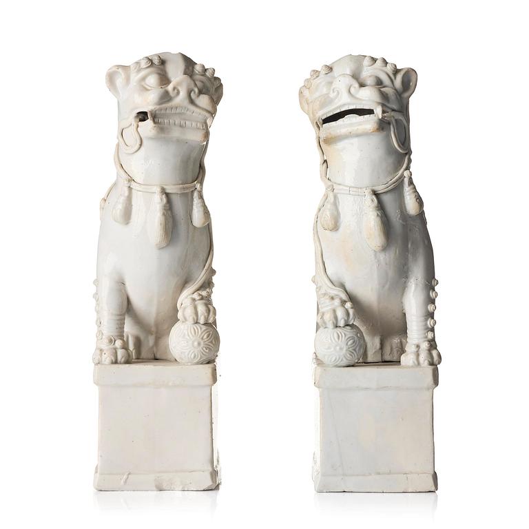 A pair of Chinese blanc de Chine 'Buddhist lion' joss stick holders, Qing dynasty, Kangxi (1662-1722).