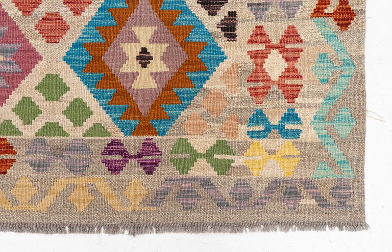 A Kelim rug, c. 252 x 180 cm.