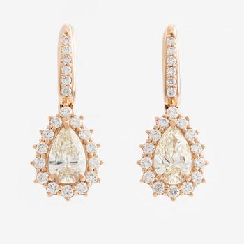 Earrings with drop-cut diamonds accompanied by brilliant-cut diamonds, including a GIA dossier.