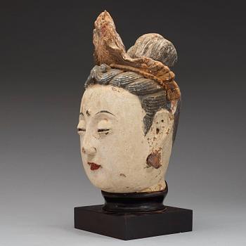 A stucco head of a Bodhisattva, Ming dynasty (1368-1644).