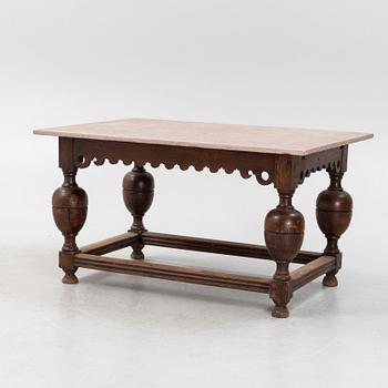 A Baroque oak and stone top table, 18th Century.