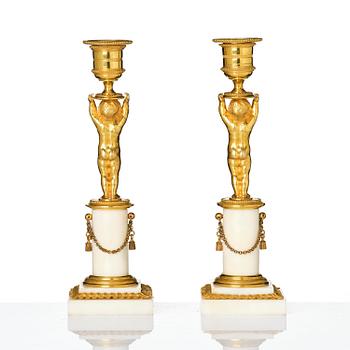 A pair of late Gustavian ormolu and white marble candlesticks, Stockholm, late 18th century.