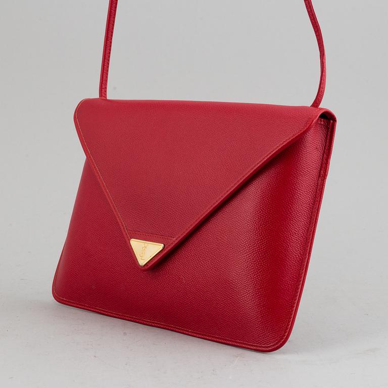 YVES SAINT LAURENT, a red leather bag.