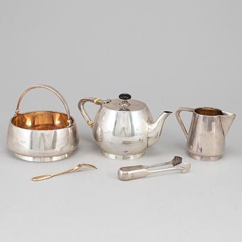 A Russian early 20th century parcel-gilt silver 5 piece tea-set, mark of Grachev, St. Petersburg 1908-1917.