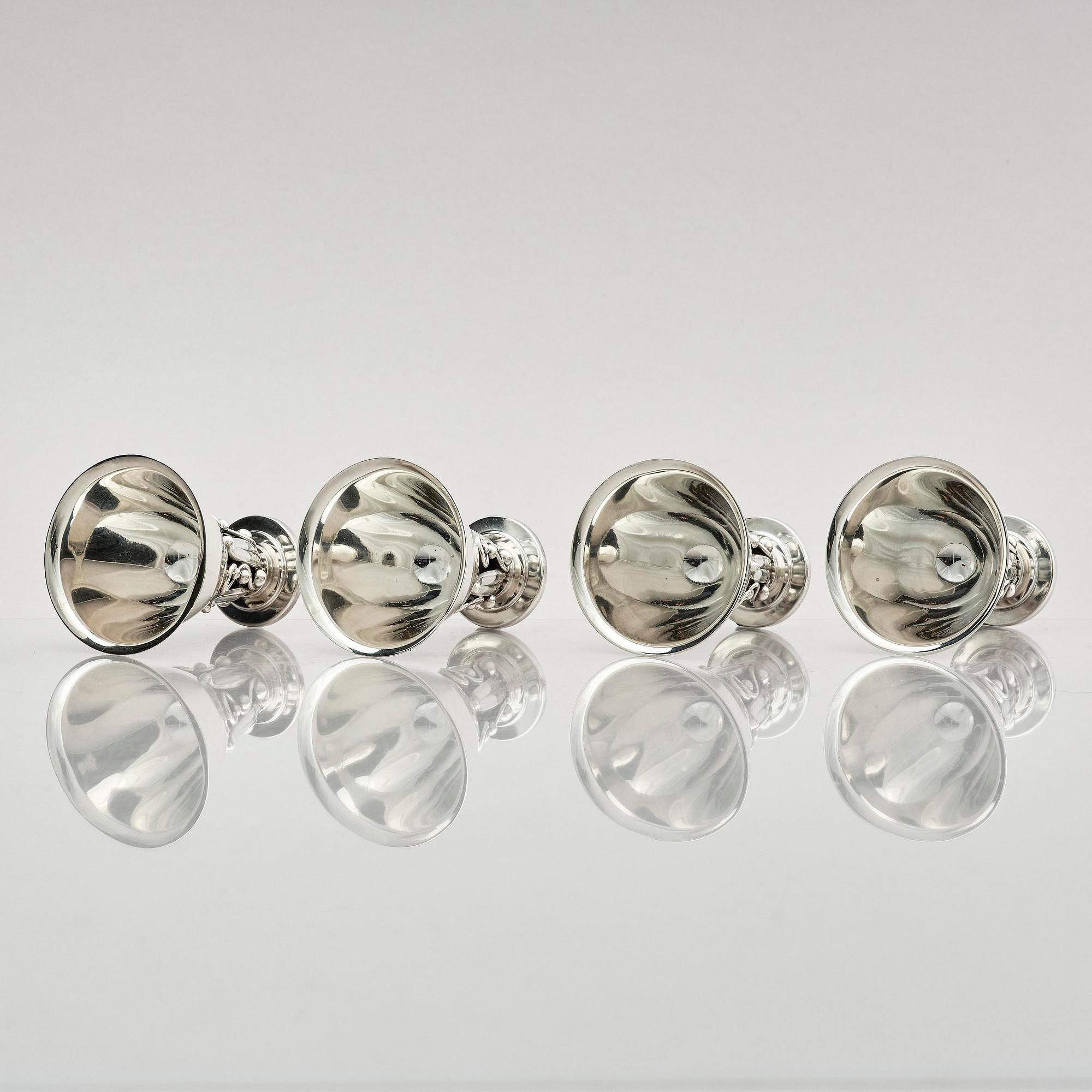 Evald Nielsen, four sterling silver beakers/cups on a foot, Denmark 20th century.