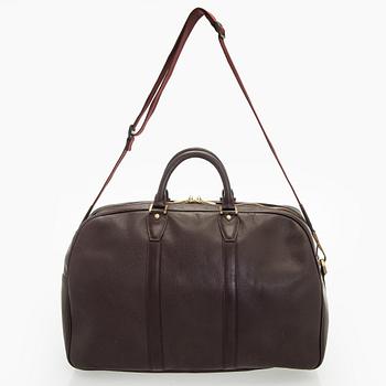 Louis Vuitton, a 'Taiga Kendall PM' weekend bag.