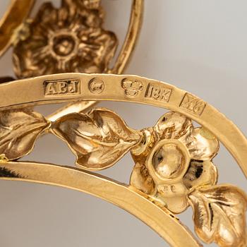 18K gold bow brooch.