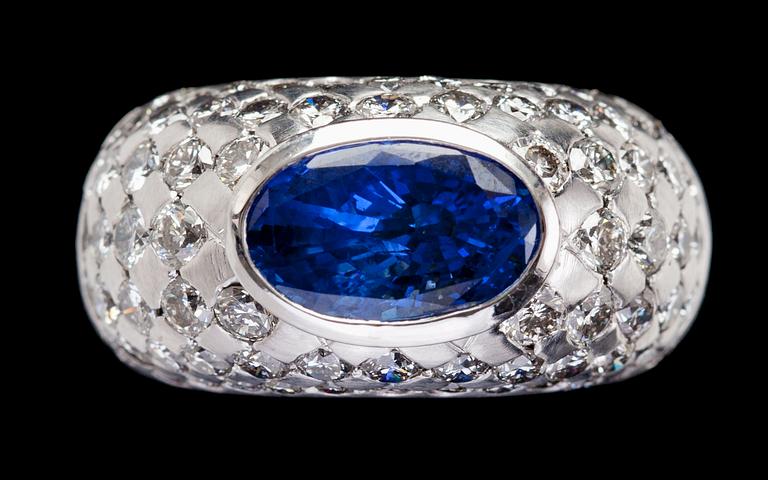 A blue sapphire, 3.86 cts, and diamond ring.