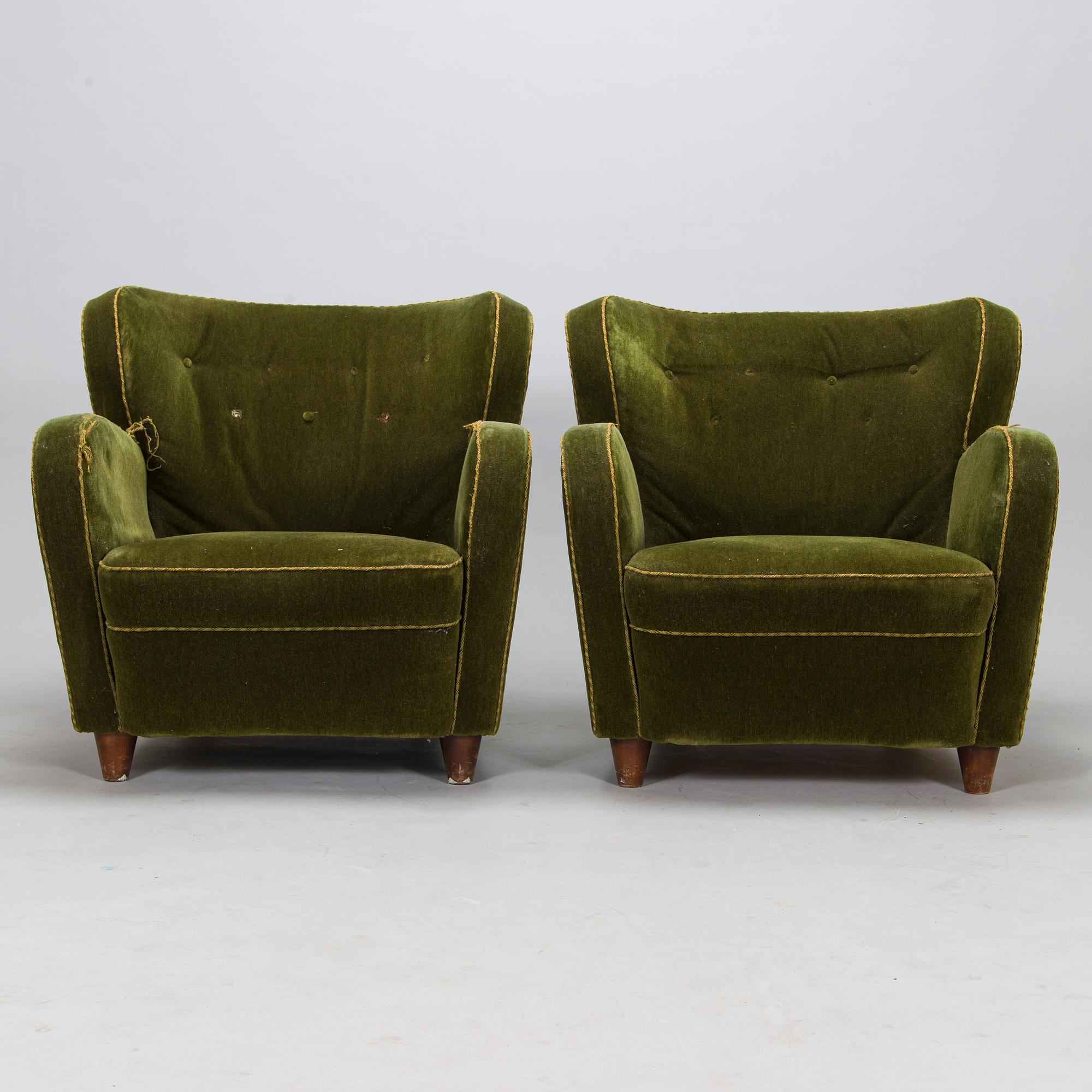 A pair of mid-20th-century armchairs.