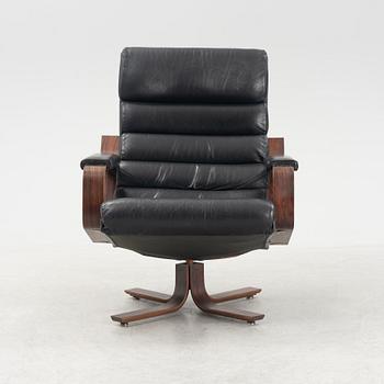 Karl-Erik Ekselius, a rosewood swivel armchair from JOC Vetlanda, 1980's.