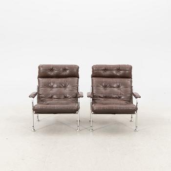 A pair of "Stålbo" easy chairs by Bo Eigert for B. Eigert AB Hova Sweden 1970:s.