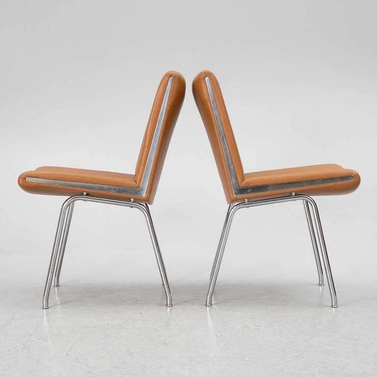 Hans J. Wegner, a pair pf "Kastrup Airport" lounge chairs, Denmark, late 20th century.