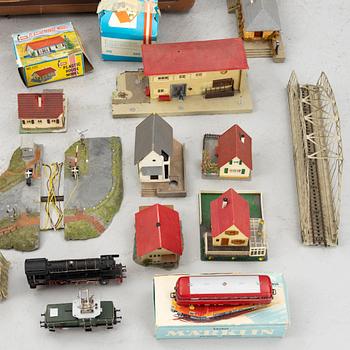 Märklin, among others, collection of locomotives, carriages, and accessories, 1950s-60s.