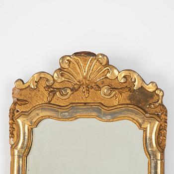 A Swedish rococo giltwood mirror, later part 18th century.