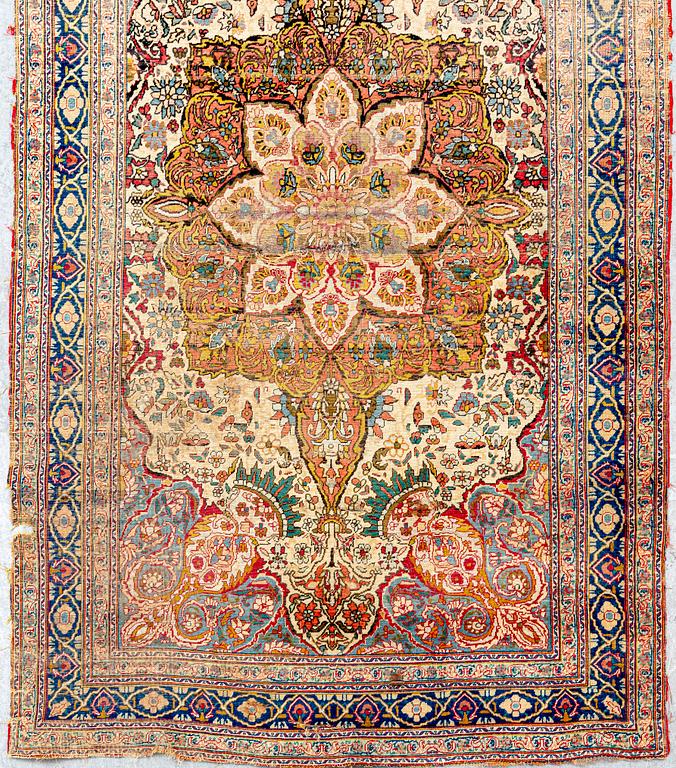 An antique Turkish /Hereke) signed carpet ca 200x121 cm.