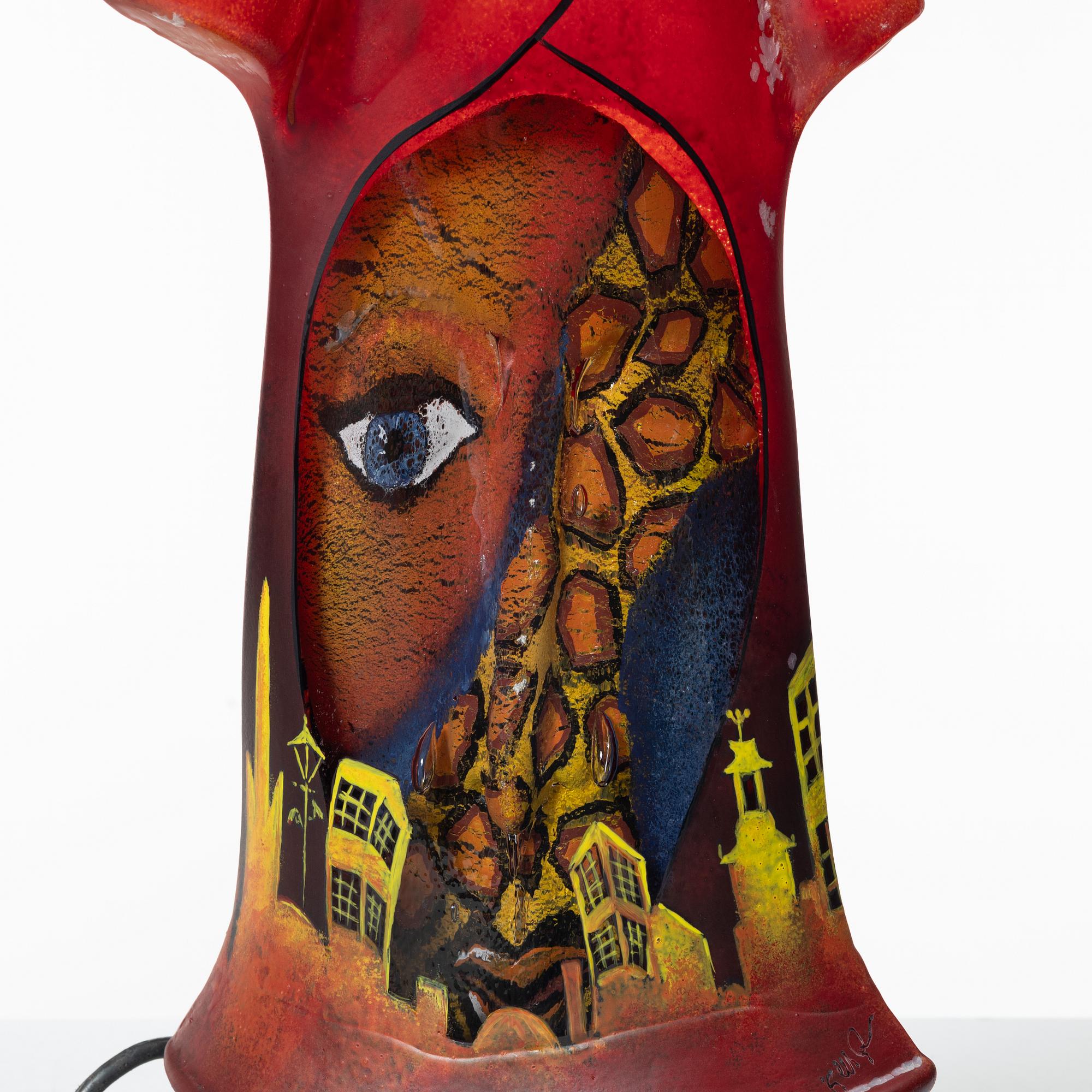 Kjell Engman, Bevingad figur i röd rock.