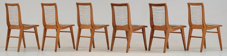 A Louis Sognot set of six ash, metal and rubber chairs, France 1950's.