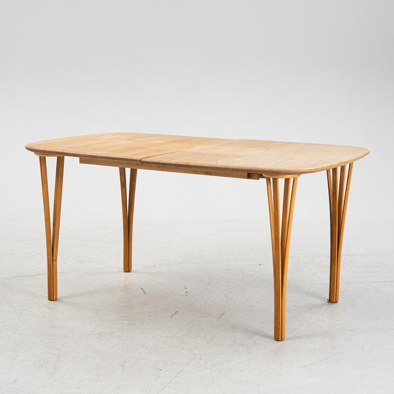 A 'Timeless' oak dining table, Haslev Møbelsnedkeri, Denmark.