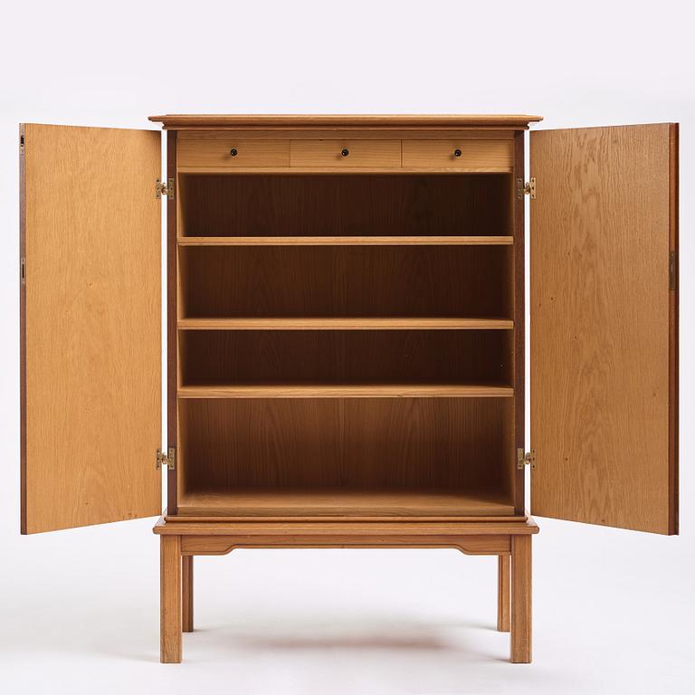 Oscar Nilsson, attributed to, a Swedish Modern oak cabinet, 1940s.