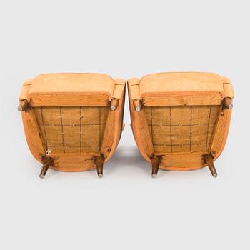 A pair of mid-20th century armchairs.