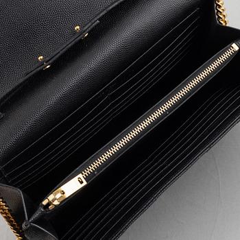 Yves Saint Laurent, a handbag/clutch.