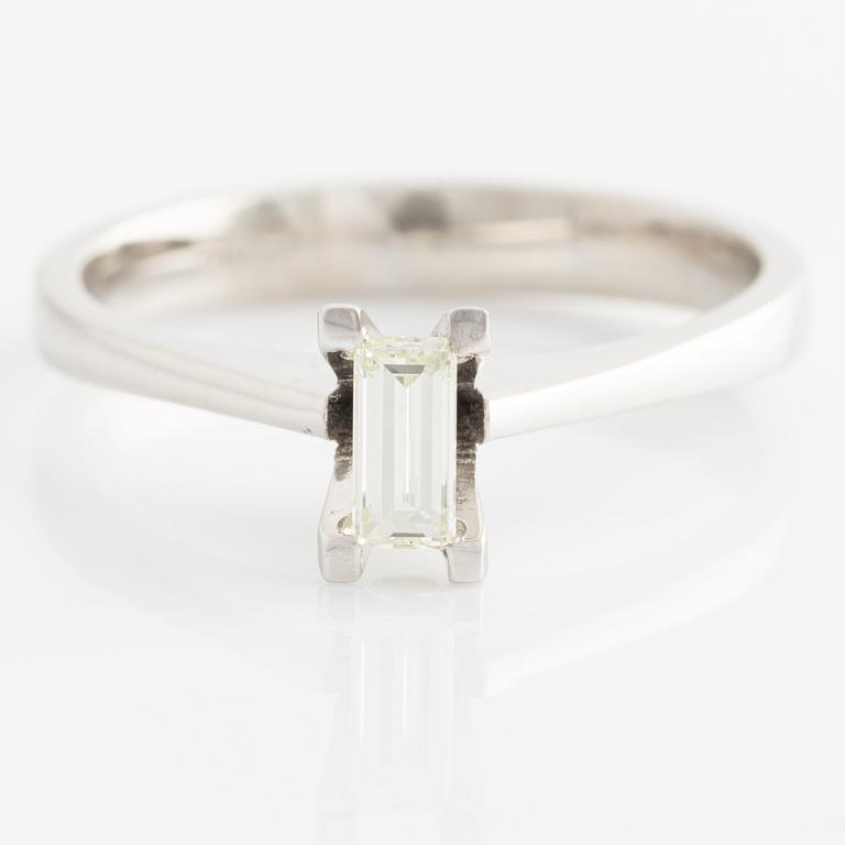 Ring with baguette-cut diamond.
