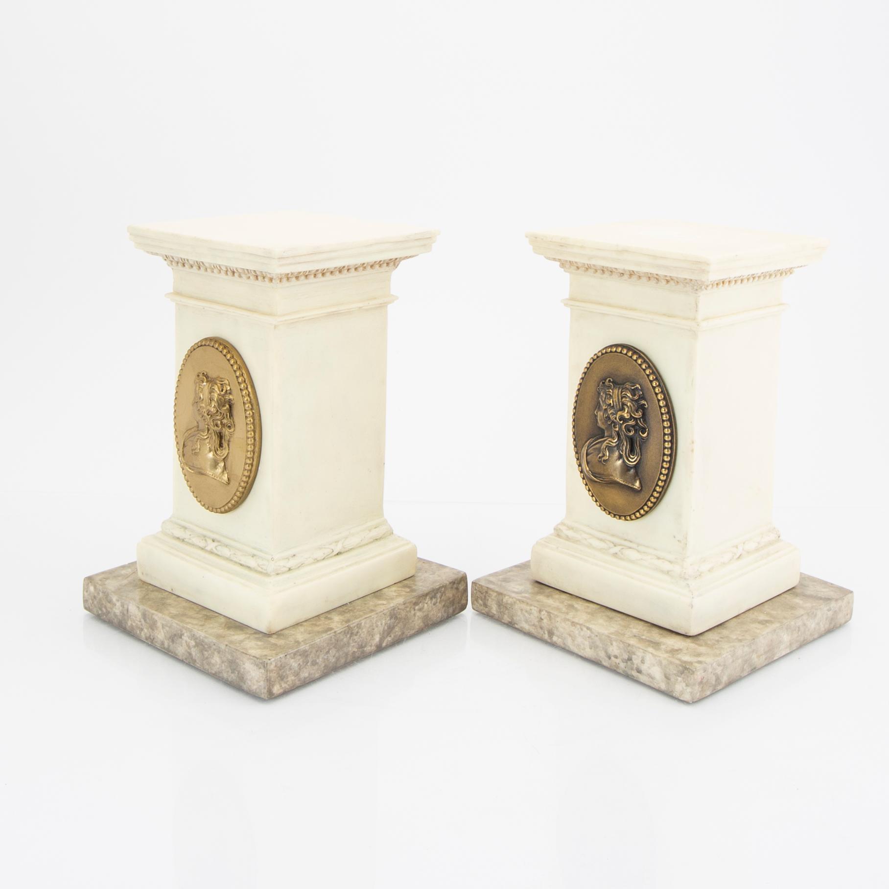 A pair of modern plaster statues of Napoleon.
