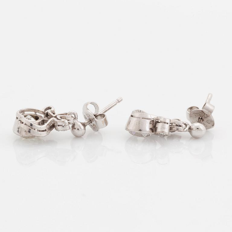 A pair of 18K white gold earrings set with old-cut diamonds.