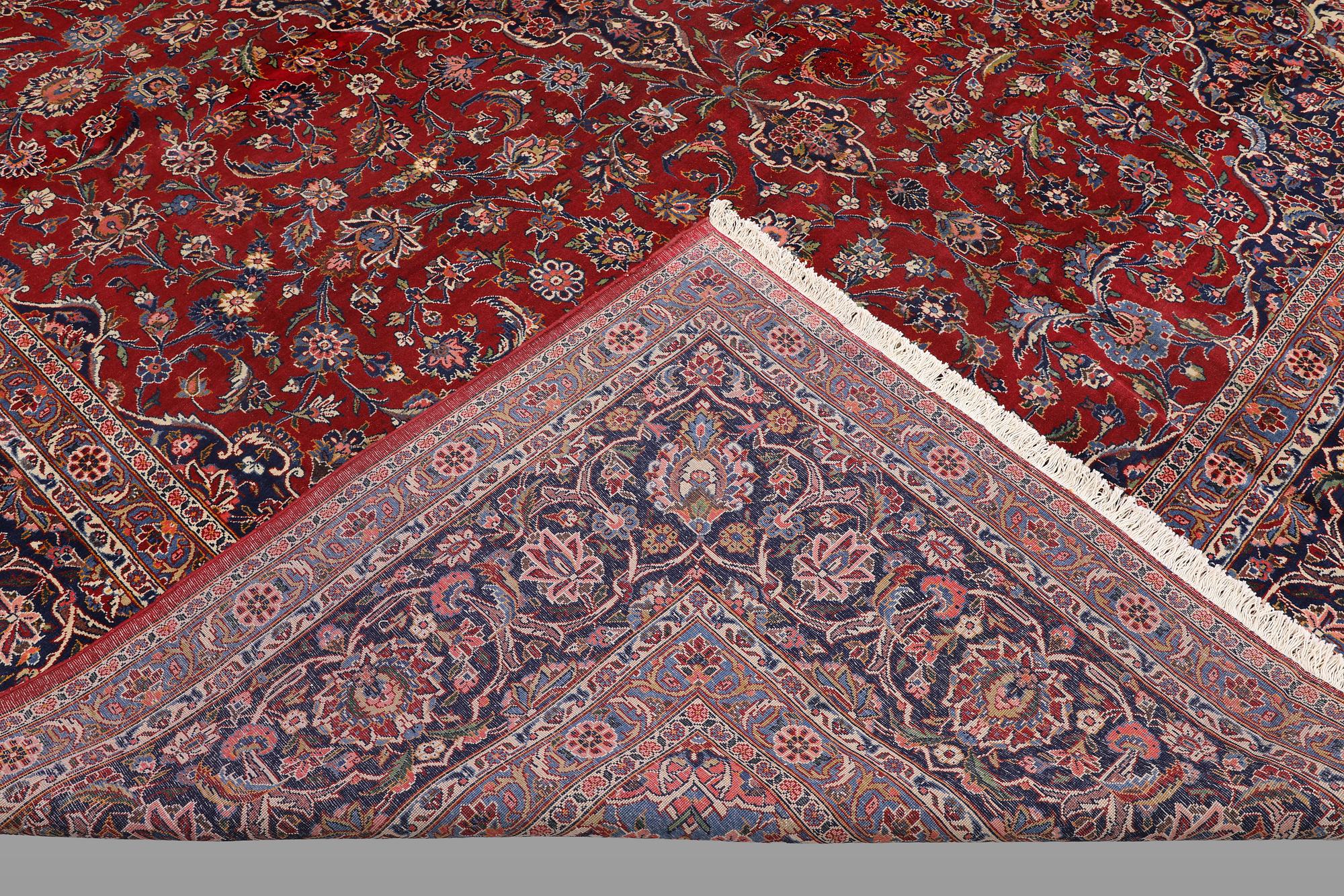 A semi-antique Keshan carpet, signed, 449 x 317 cm.