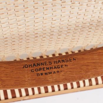 Hans J. Wegner, a pair of teak and rattan 'The Chair', JH-503, Johannes Hansen, Denmark 1950s.