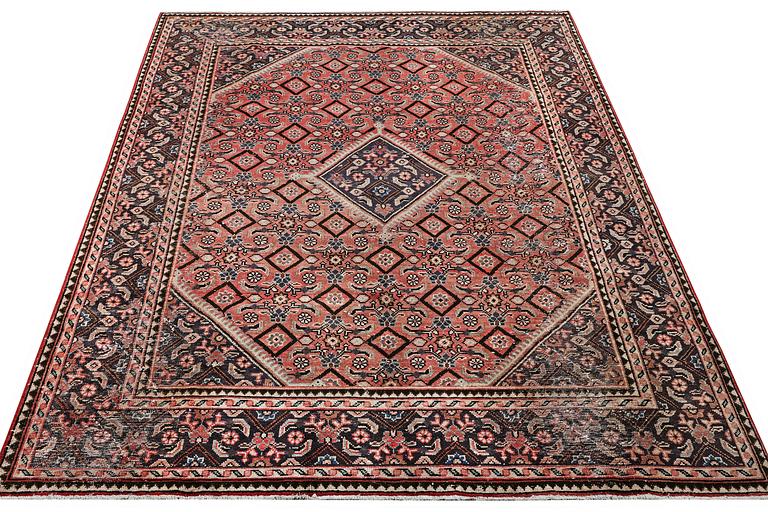 An oriental, vintage design rug, c. 286 x 208 cm.