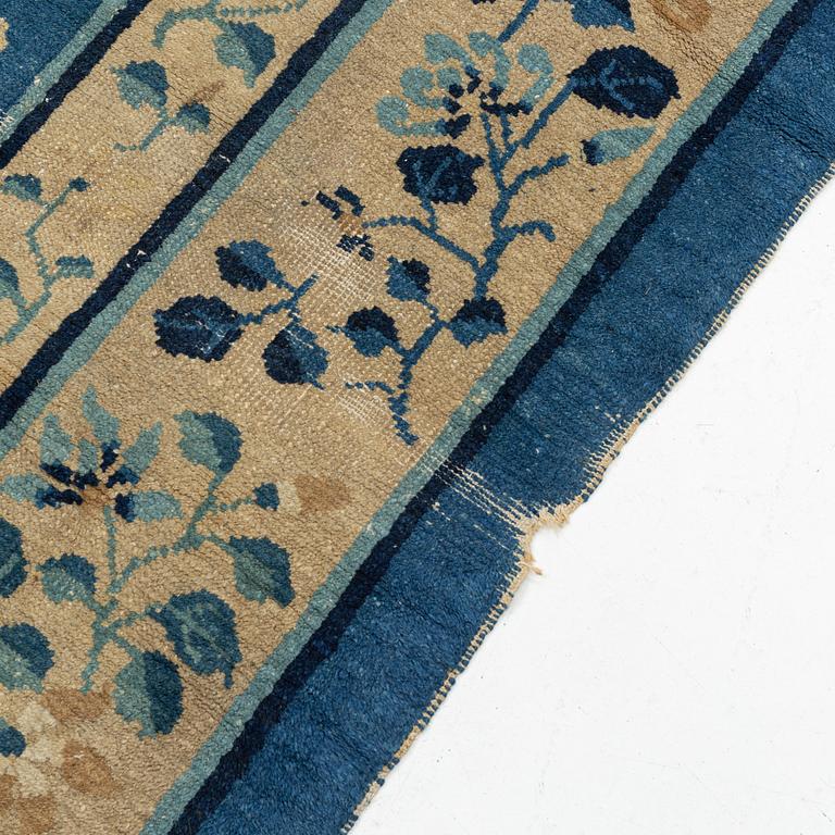 An antique Chinese carpet, c. 355 x 270 cm.