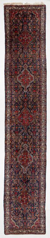 A runner, oriental, approx. 555 x 100 cm.