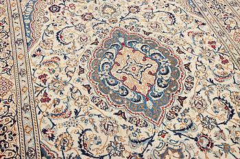 A Nain carpet, part silk, 9 laa, c. 300 x 195 cm.