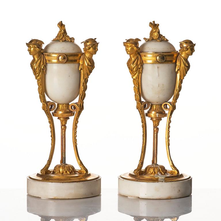 A pair of Louis XVI Cassolettes, white marble and gilt-bronze, around 1790.