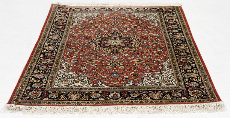 An Oriental part silk rug, c 158 x 110 cm.