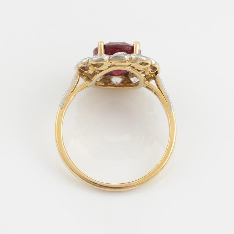 An 18K gold and platinum ring set with a faceted ruby weight ca 3.35 cts.