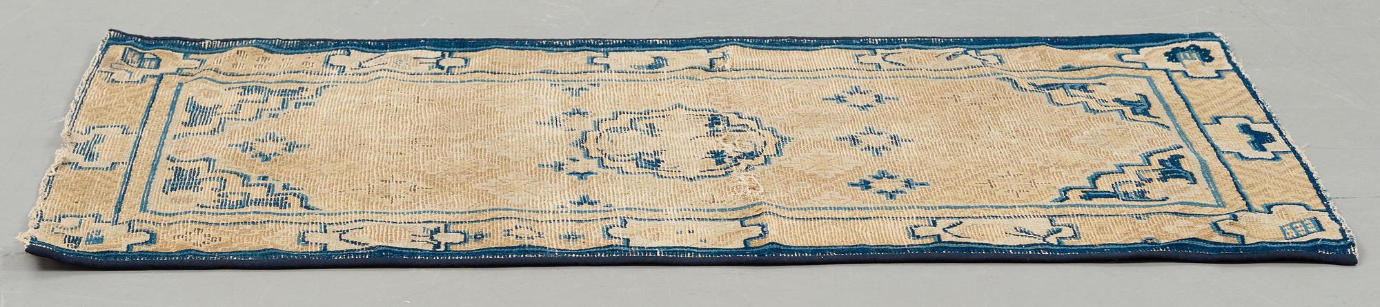 A RUG, an antique Ningxia, China, late Qing, ca 130 x 70,5 cm.
