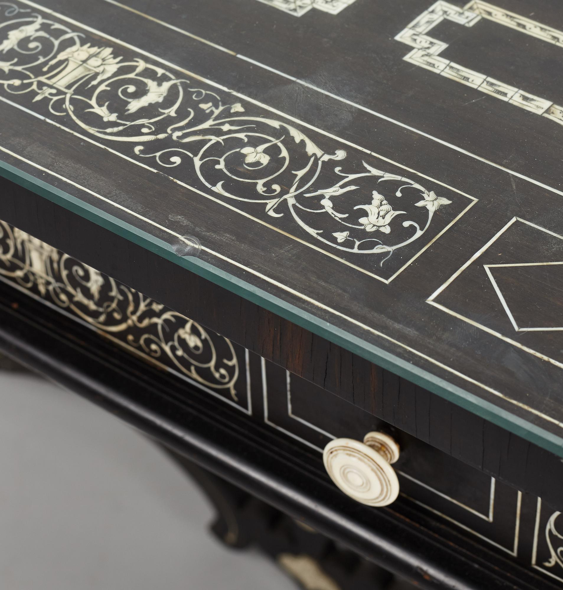 A Renaissance-style ebony, ebonized and ivory-inlaid library table, late 19th century, presumably Germany.